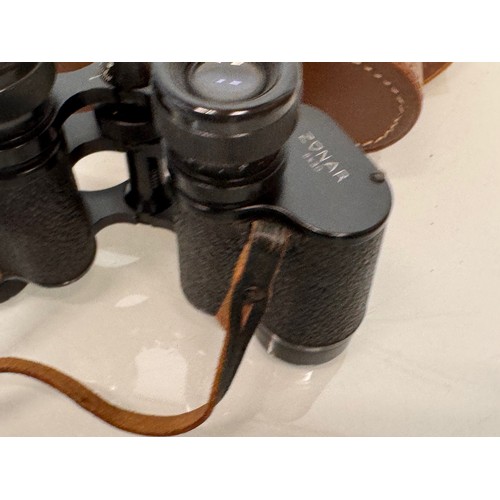 317 - Mid C20th Dolland of London field glasses with a leather case.

This lot is available for in-house s... 