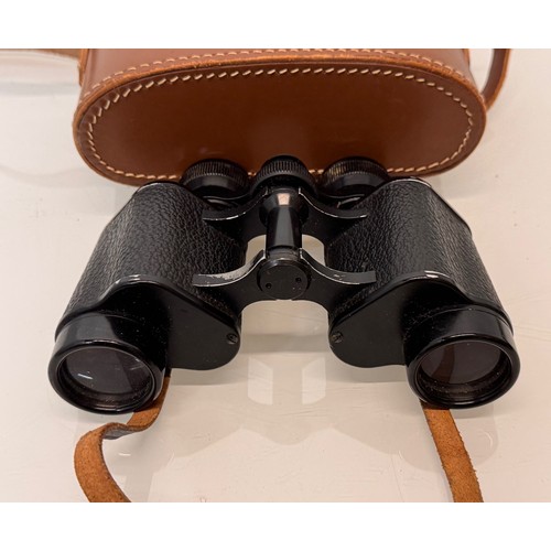 317 - Mid C20th Dolland of London field glasses with a leather case.

This lot is available for in-house s... 