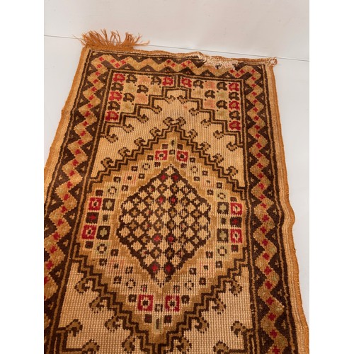 340 - Furnishings, a woven wool floor rug, 110 cm x 61 cm.

This lot is available for in-house shipping