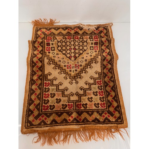 340 - Furnishings, a woven wool floor rug, 110 cm x 61 cm.

This lot is available for in-house shipping