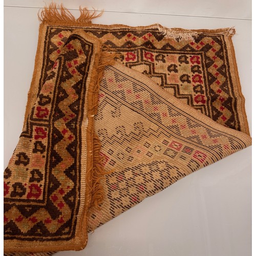 340 - Furnishings, a woven wool floor rug, 110 cm x 61 cm.

This lot is available for in-house shipping