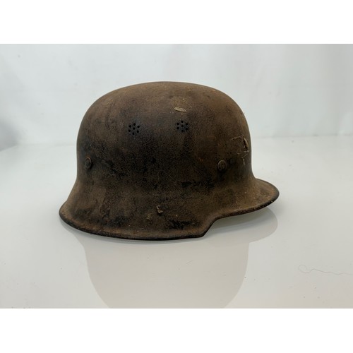 92 - Military WWII uniforms and field kit, a German light weight steel helmet with liner etc.

This lot i... 