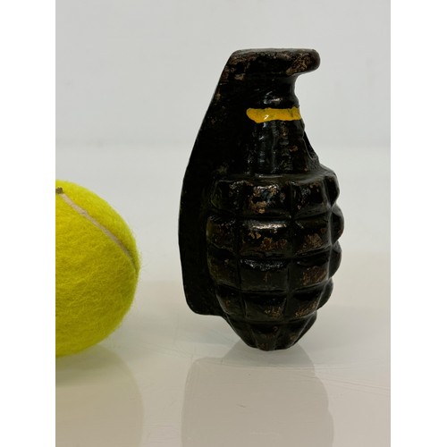 99 - Militaria, a cast iron practice grenade. 11 cm tall.

This lot is available for in-house shipping