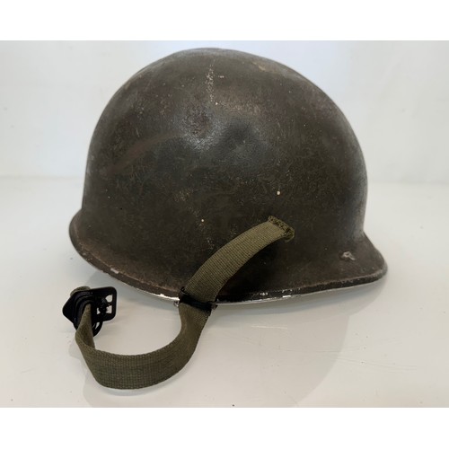 103 - Militaria, a US Vietnam War era combat helmet complete with liner etc.

This lot is available for in... 