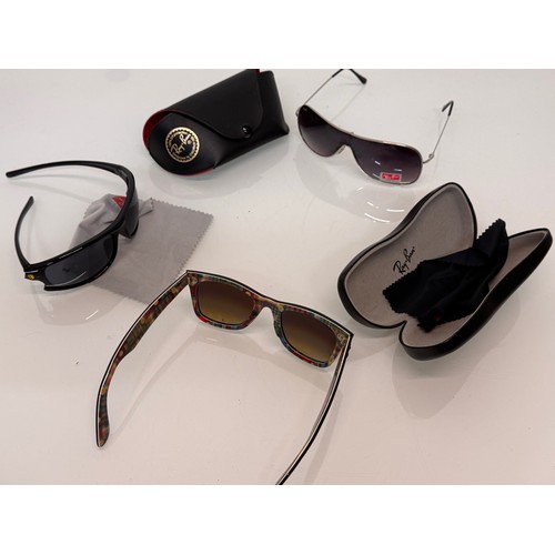 344 - Vintage Wayfarer Sunglasses, two pairs of cased Ray Bans and a pair marked with the Ferrari motor ca... 