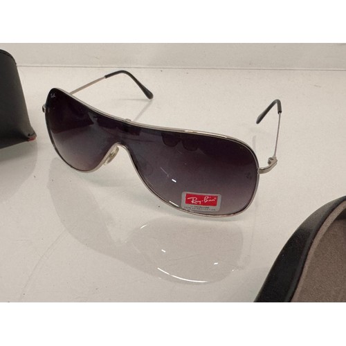 344 - Vintage Wayfarer Sunglasses, two pairs of cased Ray Bans and a pair marked with the Ferrari motor ca... 