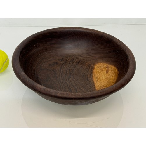 403 - A turned wooden bowl, from African hard wood, 29.5 cm diameter x 8.5 cm hogh.

This lot is available... 