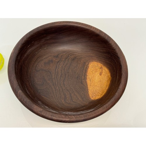 403 - A turned wooden bowl, from African hard wood, 29.5 cm diameter x 8.5 cm hogh.

This lot is available... 