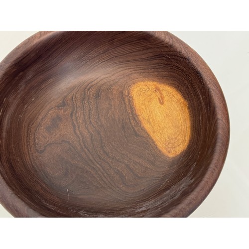 403 - A turned wooden bowl, from African hard wood, 29.5 cm diameter x 8.5 cm hogh.

This lot is available... 