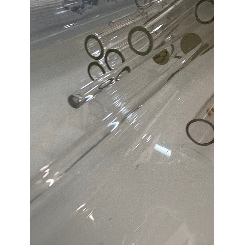 370 - Scientific glass manufacturing stock, various clear glass circular bar and tube sections.

This lot ... 