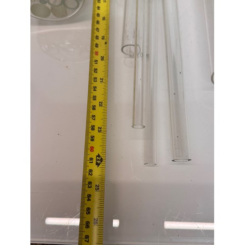 370 - Scientific glass manufacturing stock, various clear glass circular bar and tube sections.

This lot ... 