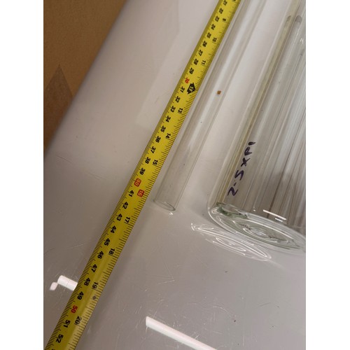 370 - Scientific glass manufacturing stock, various clear glass circular bar and tube sections.

This lot ... 