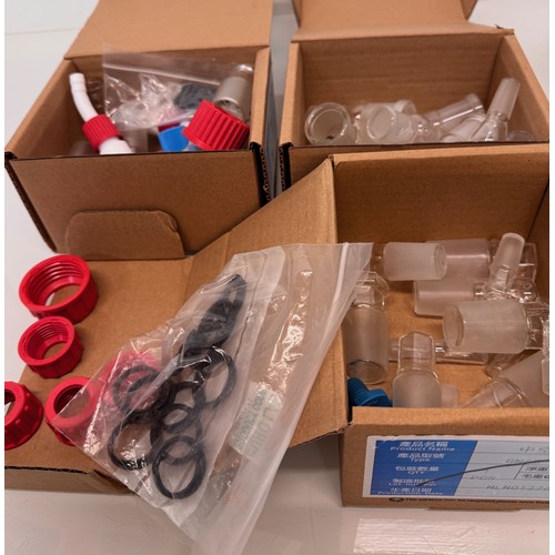 375 - Scientific workshop / laboratory fittings, Glass ware adaptors and stoppers in three boxes.

This lo... 