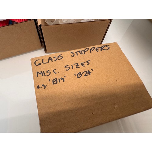 375 - Scientific workshop / laboratory fittings, Glass ware adaptors and stoppers in three boxes.

This lo... 