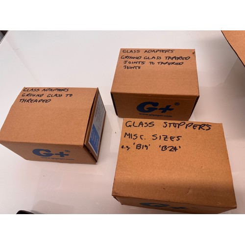 375 - Scientific workshop / laboratory fittings, Glass ware adaptors and stoppers in three boxes.

This lo... 