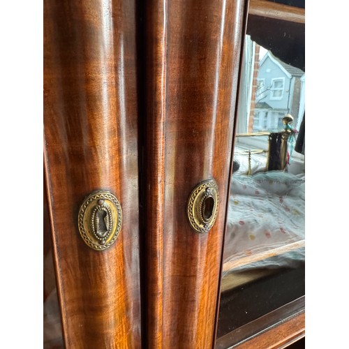 217 - Victorian furniture, a two door five section mahogany bookcase with glazed doors, one panel missing,... 