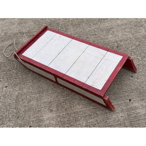 11 - Painted wooden sledge with metal runners.

This lot is available for in-house shipping