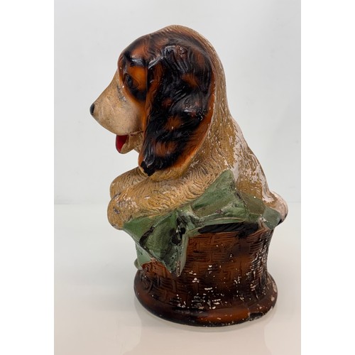 13 - A large painted plaster fairing figure of a puppy in a basket marked home sweet home, C20th kitsch. ... 