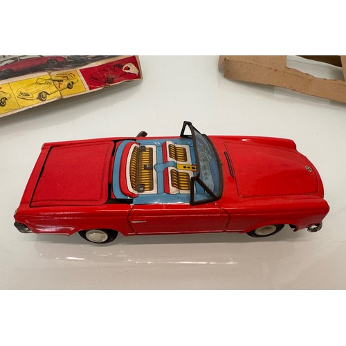 21 - Toys, Tin plate Mercedes SL sports car with retracting roof, mechanism needs attention.

This lot is... 