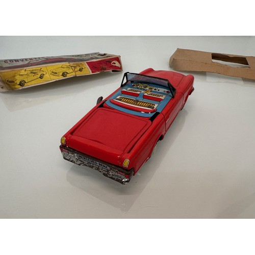 21 - Toys, Tin plate Mercedes SL sports car with retracting roof, mechanism needs attention.

This lot is... 