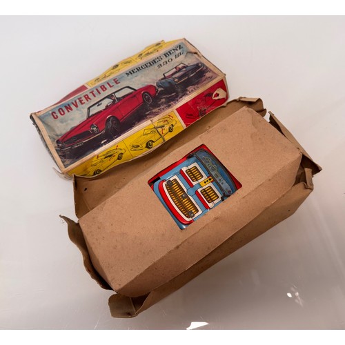 21 - Toys, Tin plate Mercedes SL sports car with retracting roof, mechanism needs attention.

This lot is... 