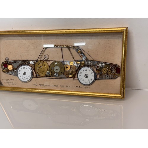 60 - Kitsch automobilia, a framed representation of a Mercedes sports car made from watch parts. 37 cm x ... 