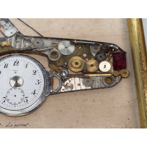 60 - Kitsch automobilia, a framed representation of a Mercedes sports car made from watch parts. 37 cm x ... 