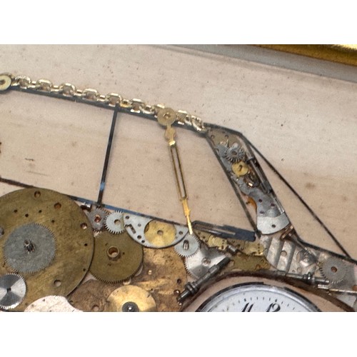 60 - Kitsch automobilia, a framed representation of a Mercedes sports car made from watch parts. 37 cm x ... 