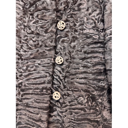 47 - Vintage fashion, a lady’s lambs wool coat marked for a Swiss Furrier.

This lot is available for in-... 