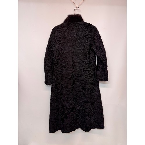 47 - Vintage fashion, a lady’s lambs wool coat marked for a Swiss Furrier.

This lot is available for in-... 