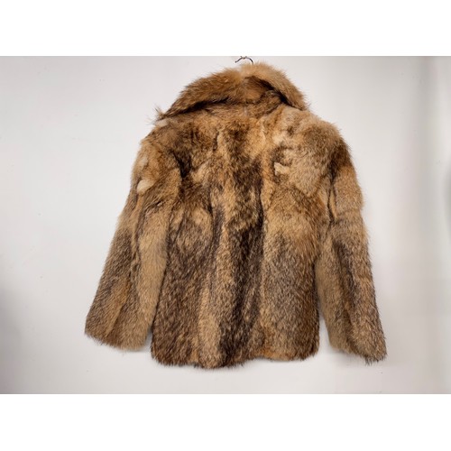 49 - Vintage fashion, a lady’s fur coat, hip length mid century design.

This lot is available for in-hou... 