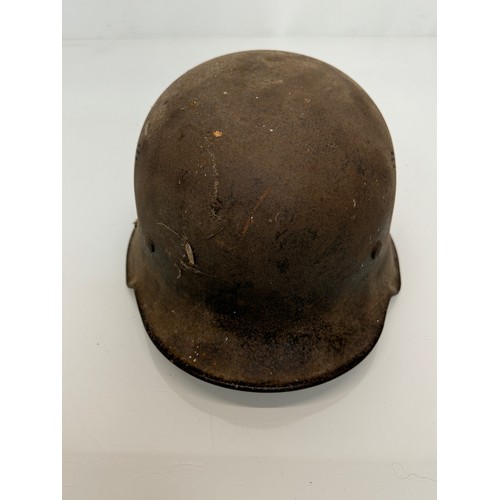 49 - Military WWII uniforms and field kit, a German light weight steel helmet with liner etc.

This lot i... 