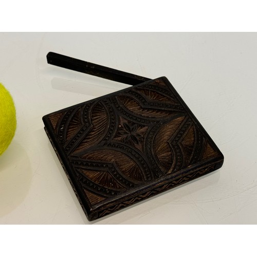 201 - A carved wooden card case, hand decorated on all sides, 10 cm x 8.5 cm.

This lot is available for i... 