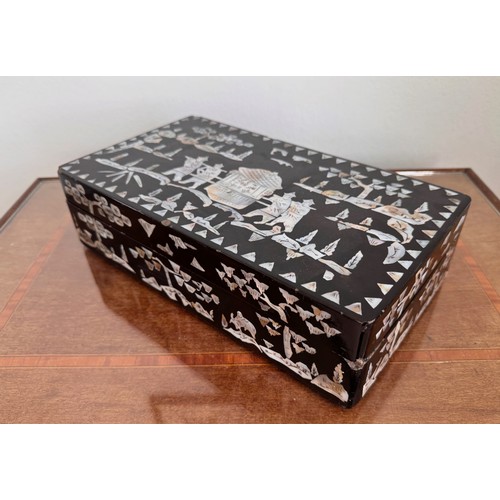 6 - Oriental black laquer box with mother of pearl decoration, 31 cm x18 cm x8 cm tall.

This lot is ava... 