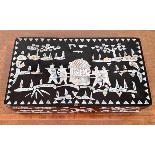 6 - Oriental black laquer box with mother of pearl decoration, 31 cm x18 cm x8 cm tall.

This lot is ava... 