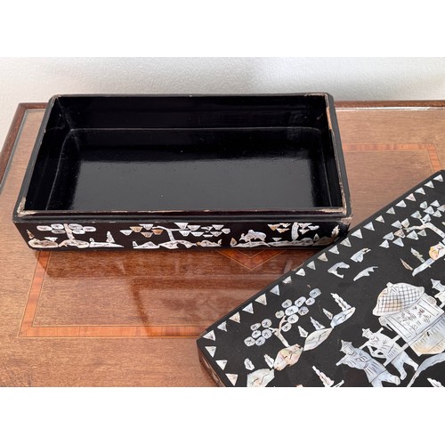 6 - Oriental black laquer box with mother of pearl decoration, 31 cm x18 cm x8 cm tall.

This lot is ava... 