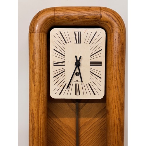 11 - Mid Century designer wall clock marked for Howard Miller USA. 85 cm tall.

This lot is available for... 