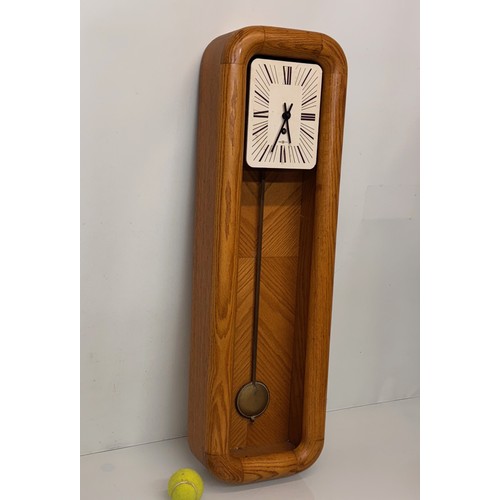 11 - Mid Century designer wall clock marked for Howard Miller USA. 85 cm tall.

This lot is available for... 