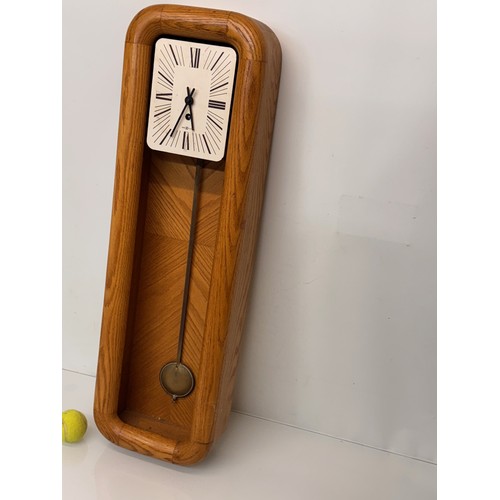 11 - Mid Century designer wall clock marked for Howard Miller USA. 85 cm tall.

This lot is available for... 