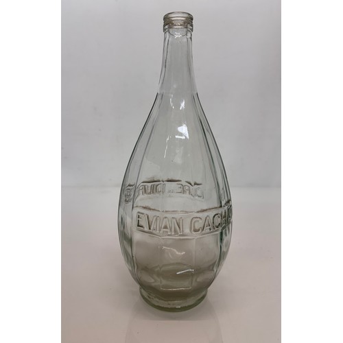 36 - A pre-war art deco Evian glass bottle 30 cm tall.

This lot is available for in-house shipping.