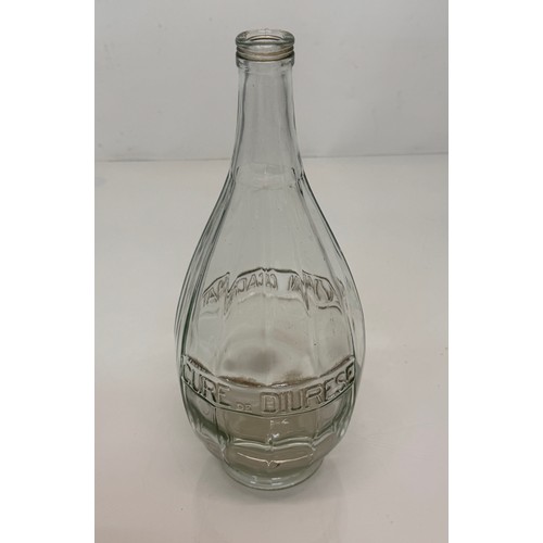 36 - A pre-war art deco Evian glass bottle 30 cm tall.

This lot is available for in-house shipping.