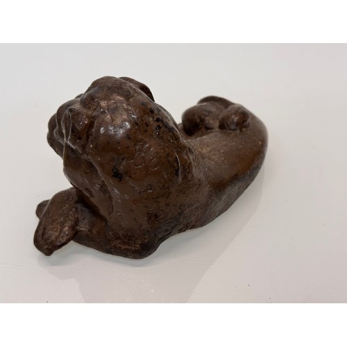 41 - Cast iron figural door stop, a recumbent lion. 21 cm long.

This lot is available for in-house shipp... 