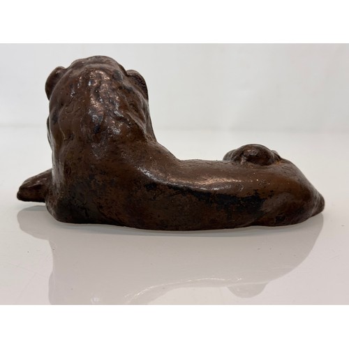 41 - Cast iron figural door stop, a recumbent lion. 21 cm long.

This lot is available for in-house shipp... 