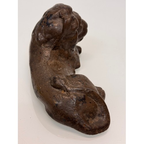 41 - Cast iron figural door stop, a recumbent lion. 21 cm long.

This lot is available for in-house shipp... 