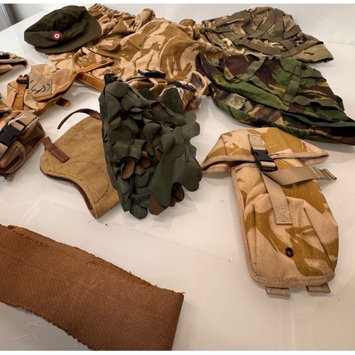 46 - Militaria, US army field equipment, includes various helmet covers and grenade and other pouches.

T... 