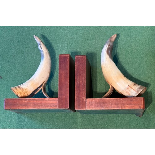 54 - Folk art book ends carved horn in the form of birds, each 18 cm tall.

This lot is available for in-... 