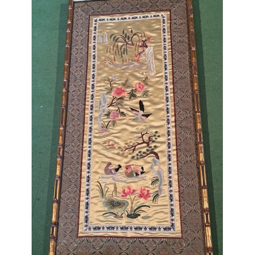 55 - Chinese textiles a framed decorative embroidered silk panel, 62 cm x 30 cm.

This lot is available f... 