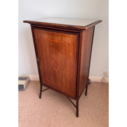 59 - Furniture, single door side cupboard with inlaid decoration. 57 cm x 37 cm x 90cm tall.

This lot is... 