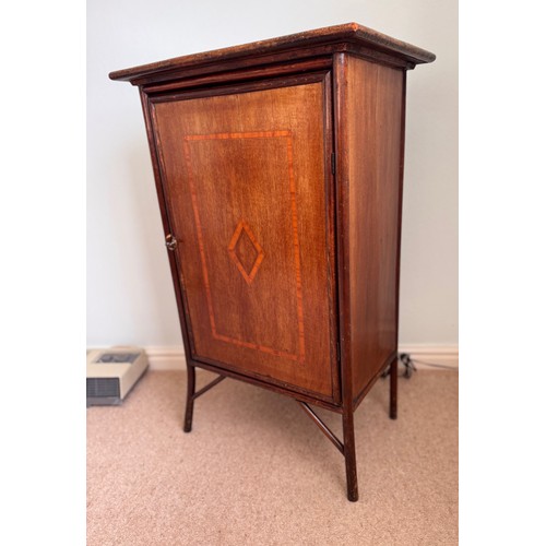 59 - Furniture, single door side cupboard with inlaid decoration. 57 cm x 37 cm x 90cm tall.

This lot is... 