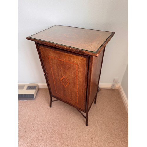 59 - Furniture, single door side cupboard with inlaid decoration. 57 cm x 37 cm x 90cm tall.

This lot is... 